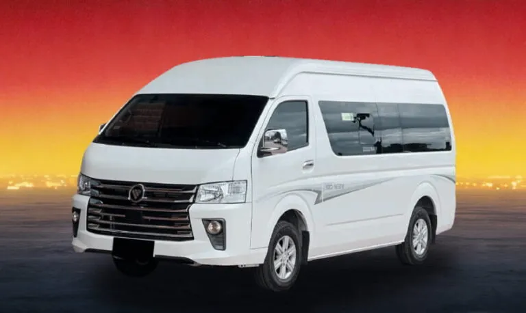 White Foton View CS2 2025 passenger van against a sunset background, available for group rental in Kuching
