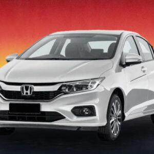White Honda sedan against a red and yellow sunset background.