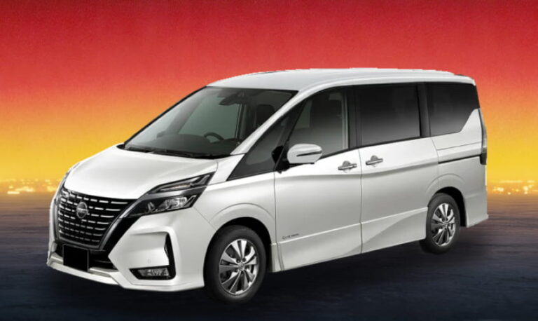 White Nissan MPV against a radiant sunset-lit horizon.