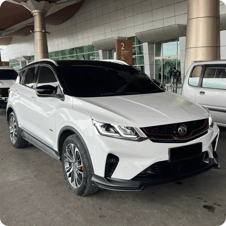 White Proton SUV parked at an airport departure area.