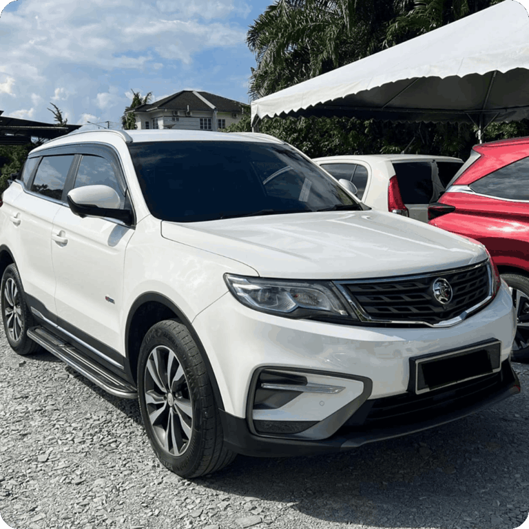 White Proton SUV parked outdoors under a canopy with other cars nearby.