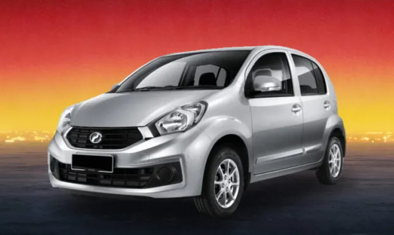 Silver Perodua Myvi 2016-2017 compact car against a dusk skyline, available for rental in Kuching