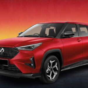 Red Perodua SUV against a fiery sunset horizon backdrop.
