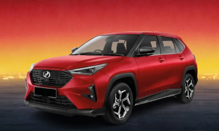 Red Perodua SUV against a fiery sunset horizon backdrop.
