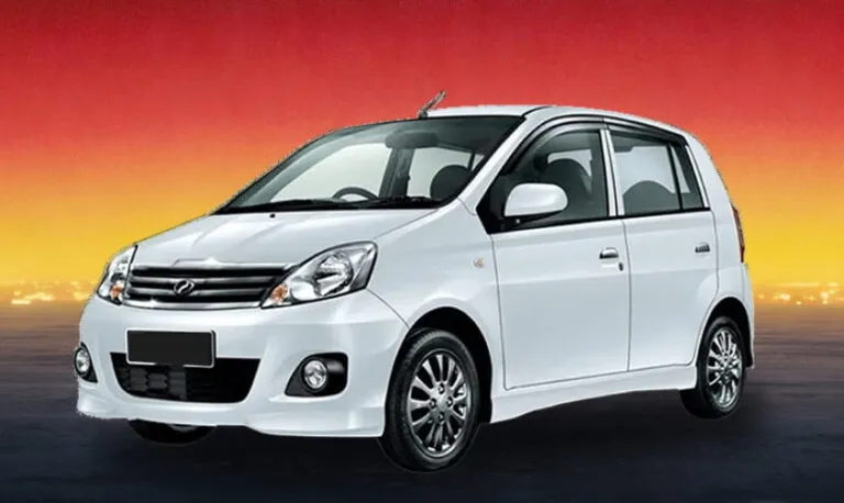 White Perodua Viva 2012 compact car against a sunset background, budget rental in Kuching
