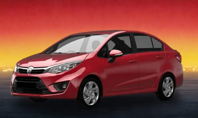 Red compact sedan car on a dark road with a red and yellow sunset sky.