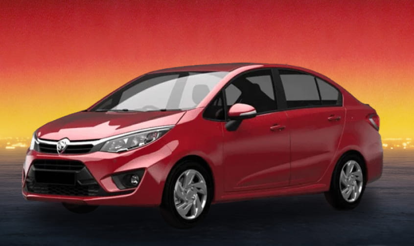 Red compact sedan car on a dark road with a red and yellow sunset sky.