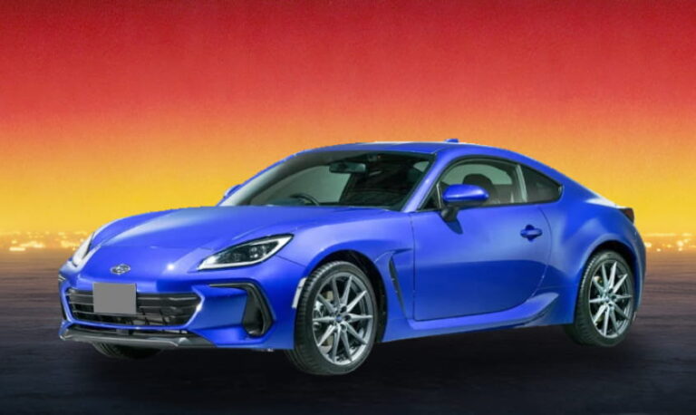 Blue Toyota sports coupe against a sunset background.